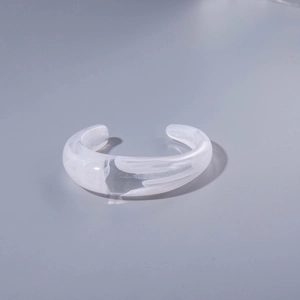 Fashionable clear acrylic open bangle with irregular white marble texture and geometric pleats