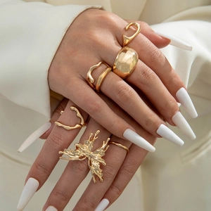 Fashionable gold alloy flower and bow ring set with vintage irregular lava texture