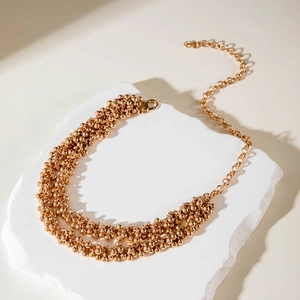 Fashionable double layered gold metal bead necklace with lobster clasp on stone base
