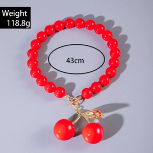 Detail view of red acrylic bead necklace with cherry pendant weighing 118.8g and 43cm long