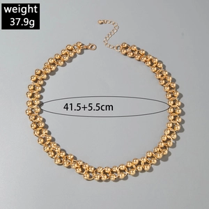 Detailed view of golden double-strand beaded necklace with length and weight measurements