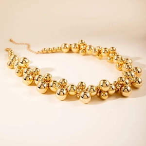 Exaggerated gold beaded choker with clustered polished CCB spheres for women