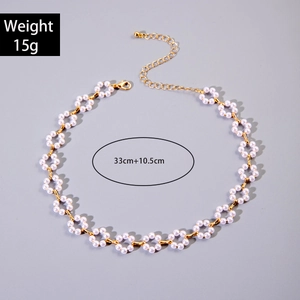 Detail view of pearl floral necklace showing 33cm length and 15g weight specs