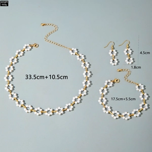 Flat lay of pearl jewelry set with necklace and bracelet dimensions and 18.8g weight