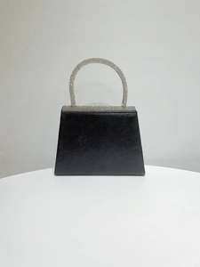 Detailed view of the black satin evening bag with rhinestone handle and crystal trim