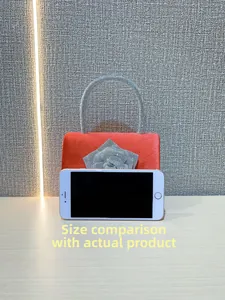 Red velvet evening bag with silver sequin rose and silver glitter handle size comparison