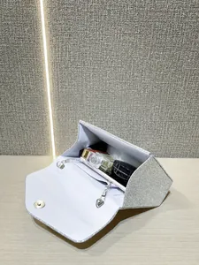 Silver glitter evening clutch bag interior showing space for phone and cosmetics