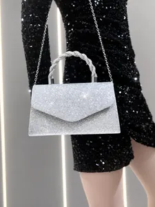 Detail of silver sequin evening clutch with metallic twisted handle and detachable chain
