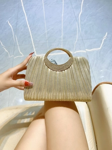 Elegant gold pleated evening clutch with sparkling rhinestone-inlaid circular handle
