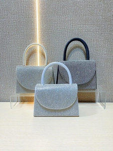 Sparkling diamond clutch handbags for evening parties in silver, blue, and black colors