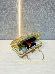 Internal view of a rhinestone evening clutch showing space for a smartphone and makeup