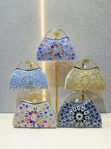 Elegant semi-circular evening clutch bag with radiating rhinestones in various colors