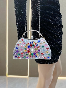 Detailed macro view of vibrant colorful rhinestones on a luxury silver evening clutch