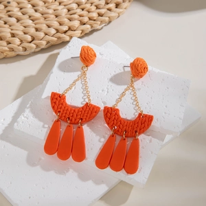 Bohemian orange woven clay earrings with geometric moon pendant and tassel dangles