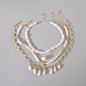 Bohemian multilayer gold necklace set with heart pendant and blue evil eye beads