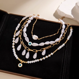 Bohemian multilayer gold chain necklace set with faux pearls and evil eye pendants
