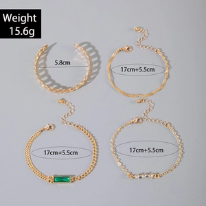 Gold vintage bracelet set featuring green rectangular gemstone and twisted chain