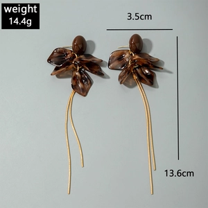 Detail of amber leopard resin earrings with gold chain, size 13.6cm and weight 14.4g