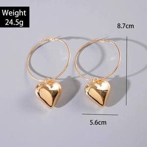 Golden hollow heart drop earrings featuring large hoops with polished finish for women