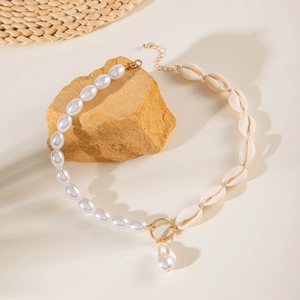 Baroque pearl and seashell necklace with gold ring and teardrop pearl pendant
