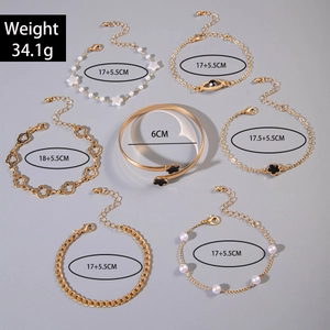 7-piece gold bracelet set with pearls, evil eye, star charms and floral bangle