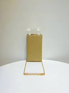 Pochette de soirée dorée pailletée avec bandoulière en chaîne pour mariages et soirées chics