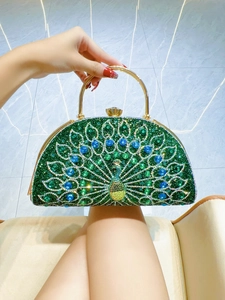 Detailed macro view of the emerald peacock evening clutch with sparkling blue rhinestones