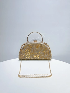 Detailed macro view of luxury evening clutch bag with champagne rhinestones and chain strap