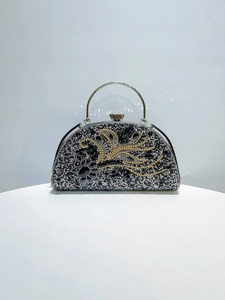 Exquisite evening bag featuring gold and silver rhinestone feather patterns and metal handle