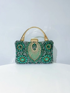 Exquisite evening bag with emerald green crystals and sparkling floral rhinestone patterns