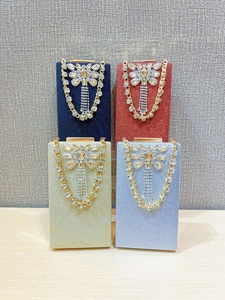 Sparkly sequin evening clutch bags with oversized crystal butterfly and rhinestone tassels