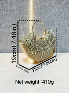 Luxurious crescent evening bag with gold spheres, rhinestones and metal ring handle