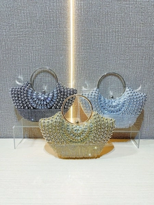 Luxury rhinestone evening bags in gold, black, and blue with beaded fan patterns