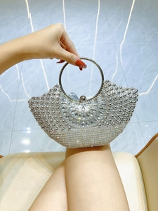 Silver fan-shaped evening clutch bag with sparkling rhinestones and metal ring handle