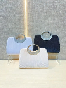 Pleated evening clutch bags with rhinestone ring handles in blue, black, and beige colors