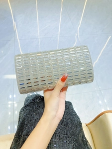 Macro shot of silver rectangular evening clutch with sparkling rhinestones for party