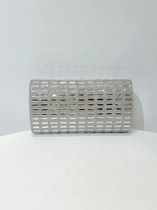 Detail of silver evening clutch bag with rectangular crystal rhinestones and metal finish