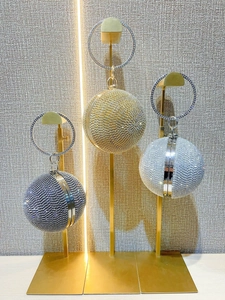 Sparkling spherical evening clutch bags with rhinestones and round handles in three colors