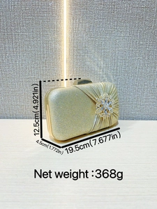 Golden glitter evening clutch bag with rhinestone flower and metal clasp closure
