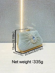 Elegant champagne pleated clutch bag with blue gemstone and crown clasp for weddings