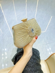 Elegant gold pleated evening clutch with crystal sunflower and droplet gemstone