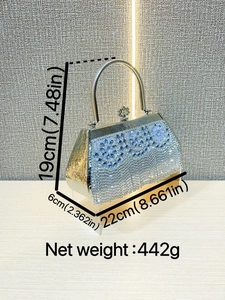 Silver rhinestone evening clutch with flower pattern and metal handle 45-degree view