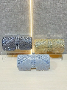 Sparkling rhinestone evening bags with fringe tassels in black, gold, and silver finishes