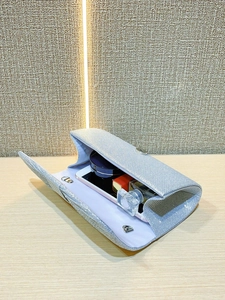 Detail view showing the spacious interior of the sparkling evening clutch bag for essentials