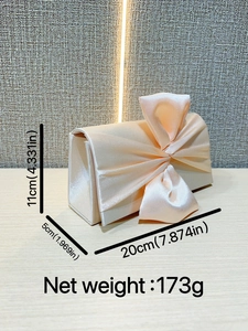 Elegant champagne satin evening clutch bag with large bow and dimensions 20x11x5cm