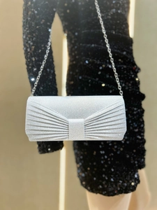 Detail of silver pleated sequin evening clutch with delicate metal chain strap