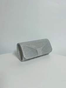 Detail of silver pleated evening clutch with sequins and square buckle for formal parties