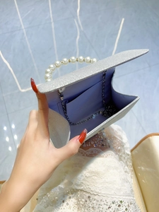 Elegant silver rhinestone evening bag with pearl handle and chain strap for women