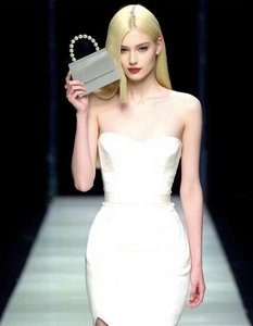 Silver glitter evening clutch featuring elegant white pearl handle for elegant women