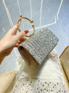 Elegant silver rhinestone evening clutch bag with golden metal ring handle and satin lining